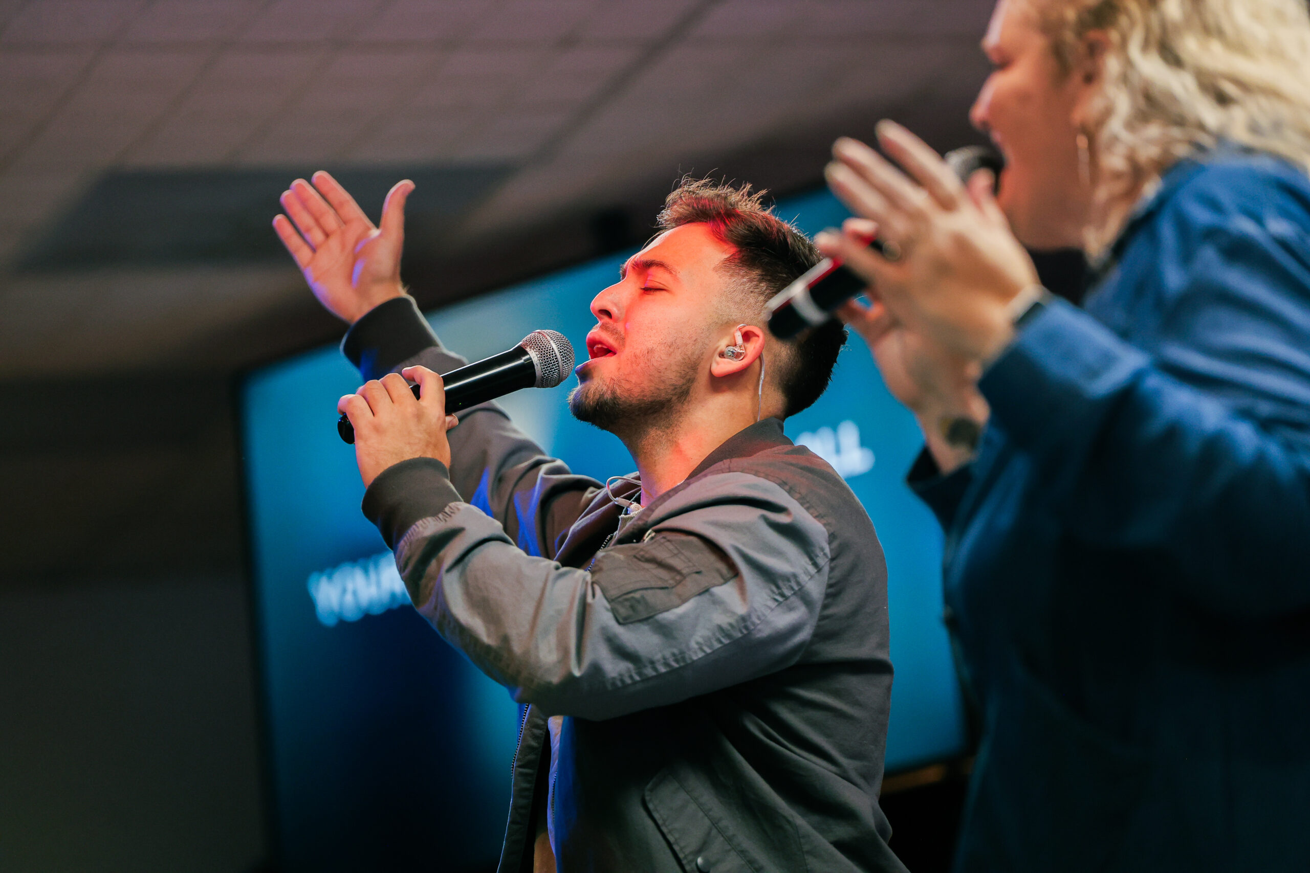 Worship Leaders raising their hands